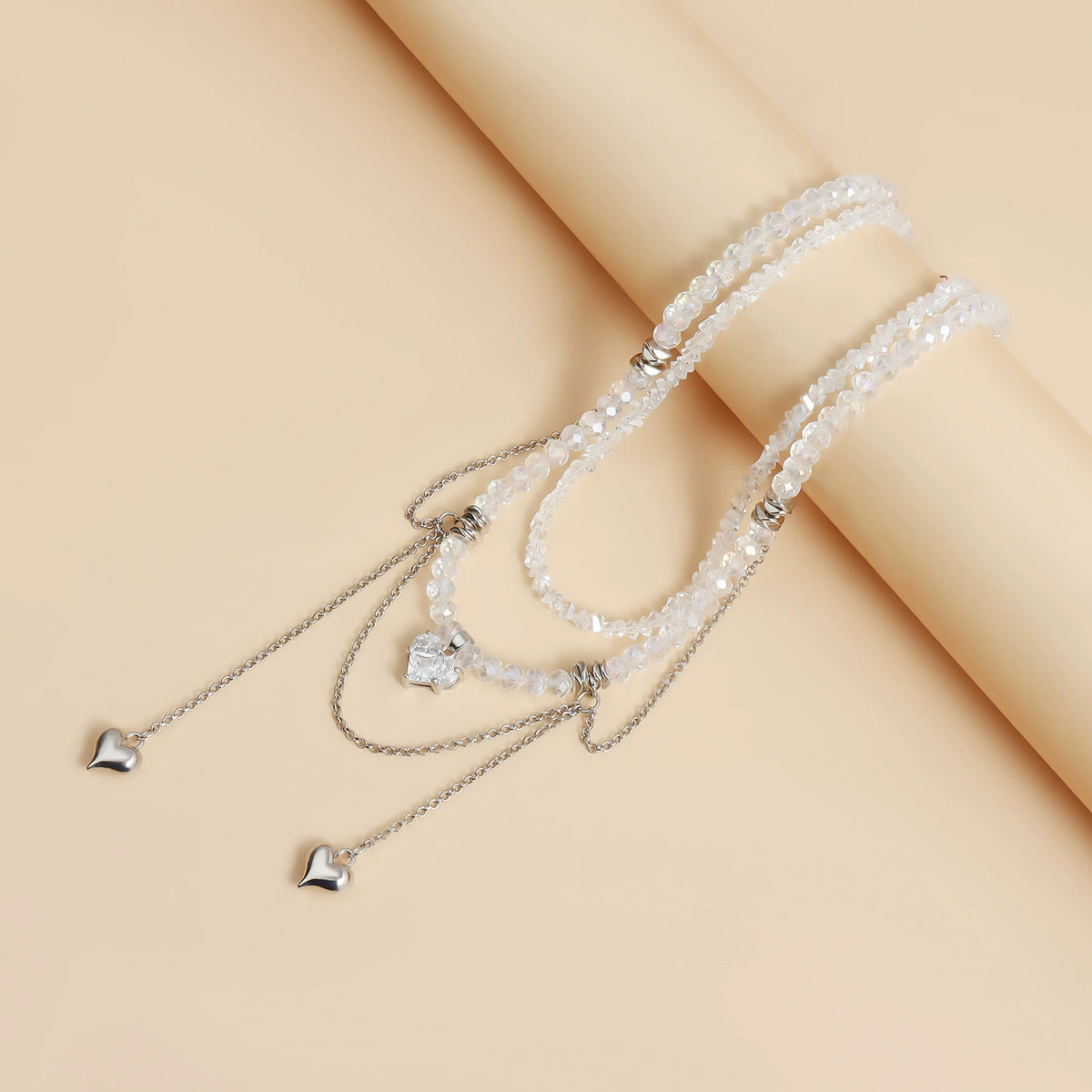 Crystal-look heart choker with draped chain fringe detail