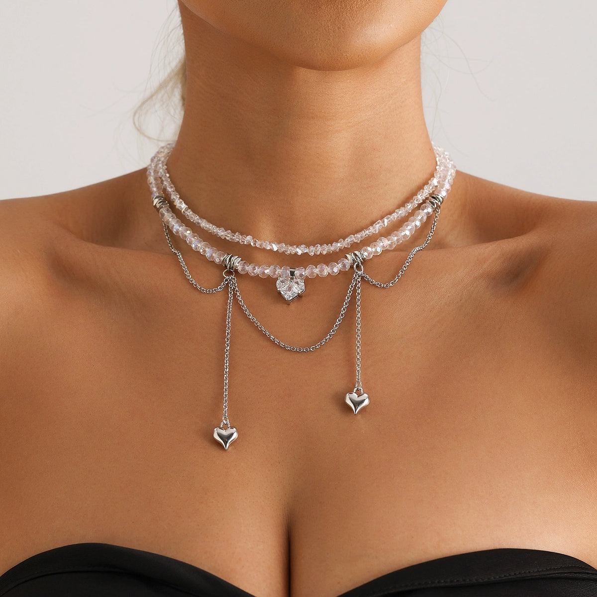 Crystal heart fringe necklace with layered silver-tone chains